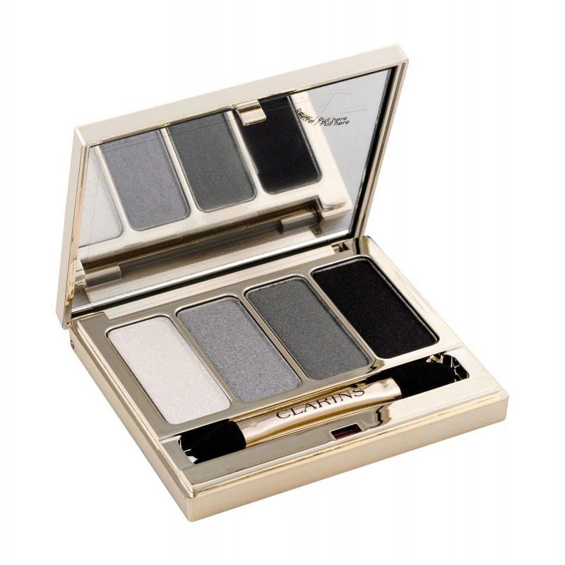 Open makeup palette with four shades of eyeshadow and a brush, featuring the Clarins brand. monza outlet, Shein outlet, monza fashion
