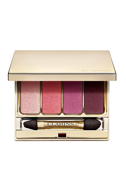 Clarins eyeshadow palette with four shades and a brush on a white background monza outlet, Shein outlet, monza fashion