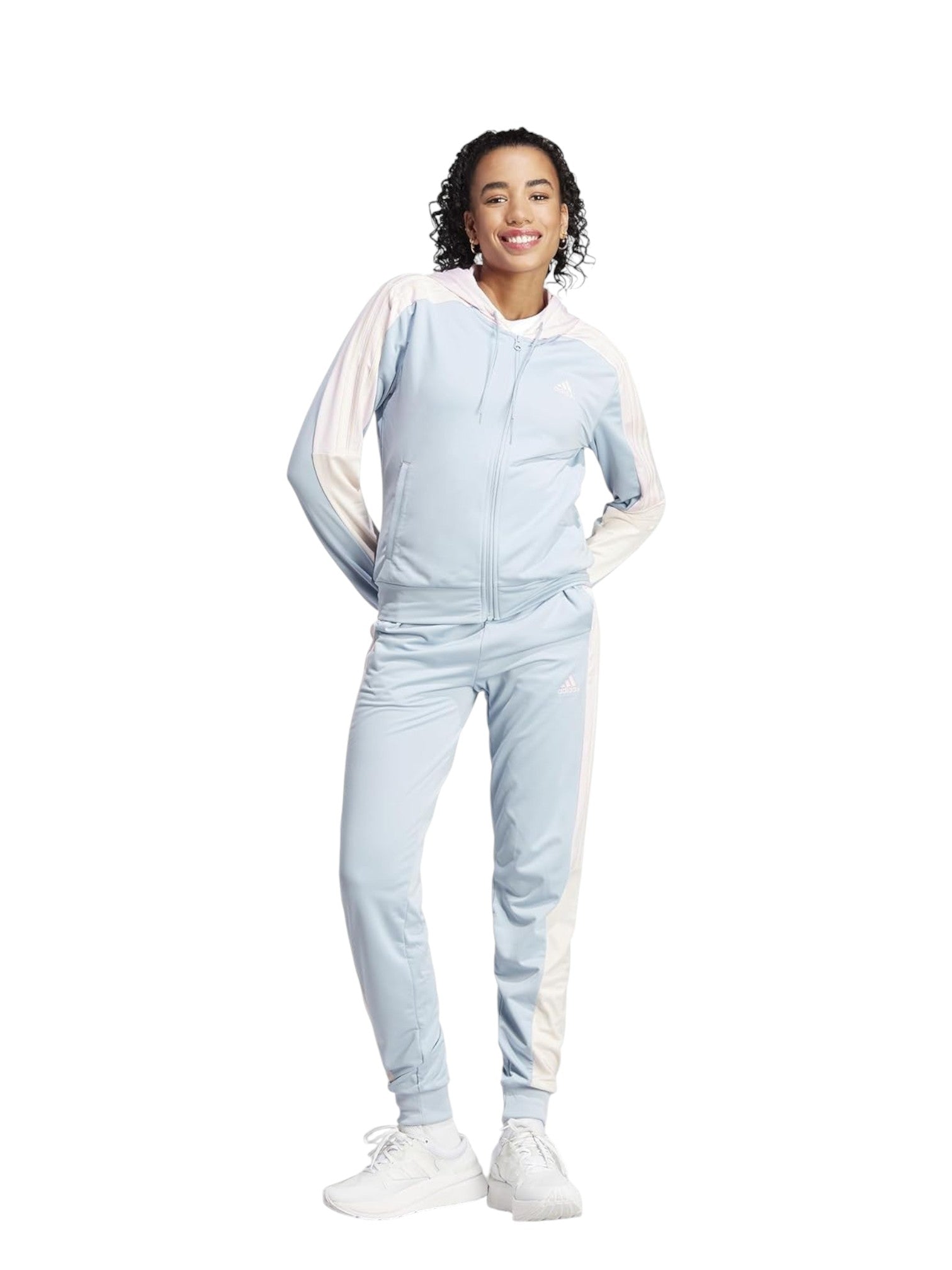 Person wearing a light blue tracksuit with white accents on a white background. Adidas, Monza Outlet, Monza Fashion, Shein Outlet
