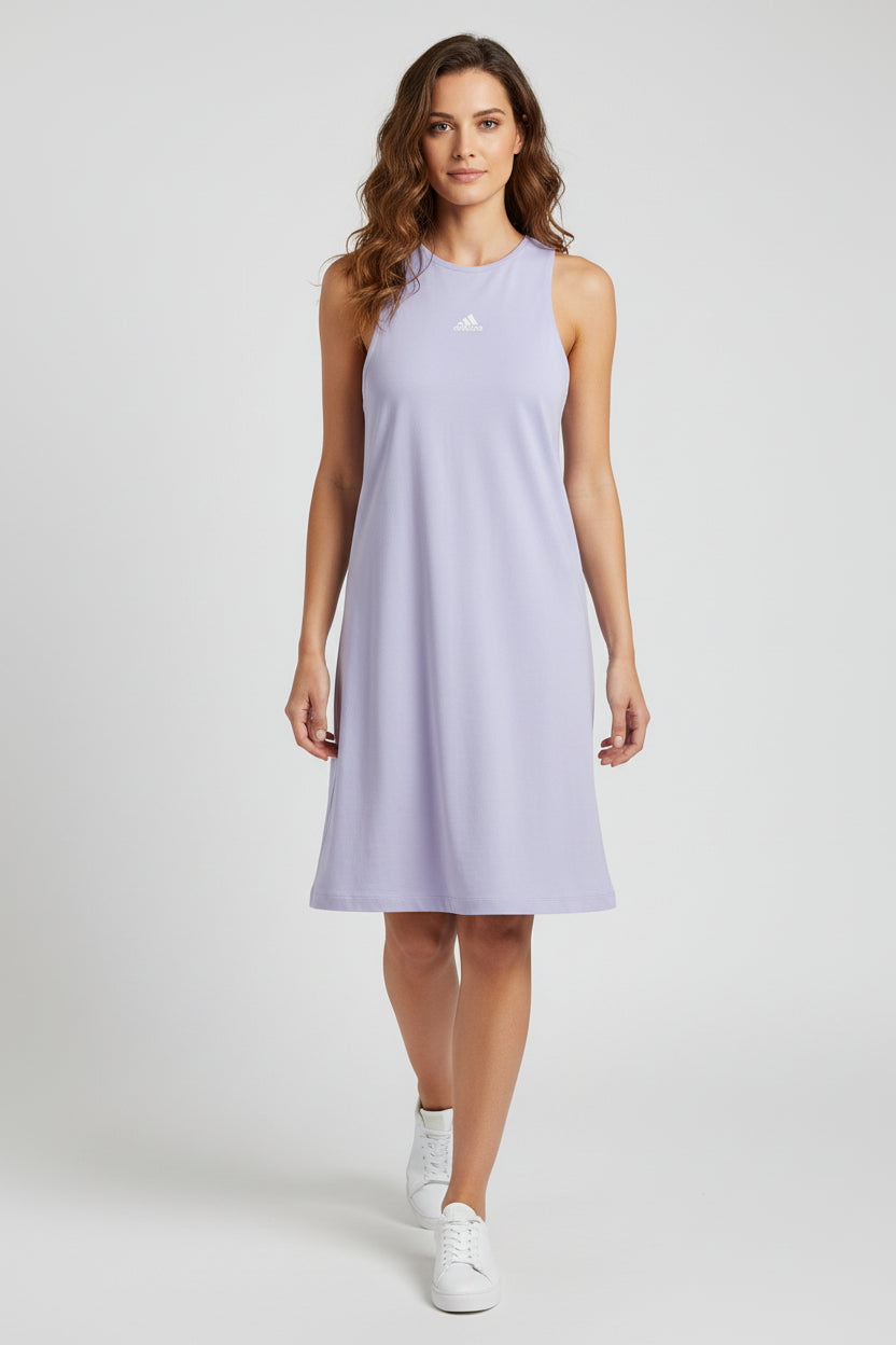 Woman wearing a light purple sleeveless dress with an Adidas logo on a white background. Adidas, Monza Outlet, Monza Fashion, Shein Outlet