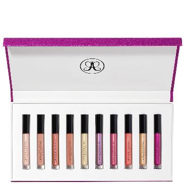 Set of lip glosses in a white case with a purple top, featuring the brand logo. Monza fashion outlet, monza outlet, shein outlet, shien outlet cosmetics, makeup, perfume