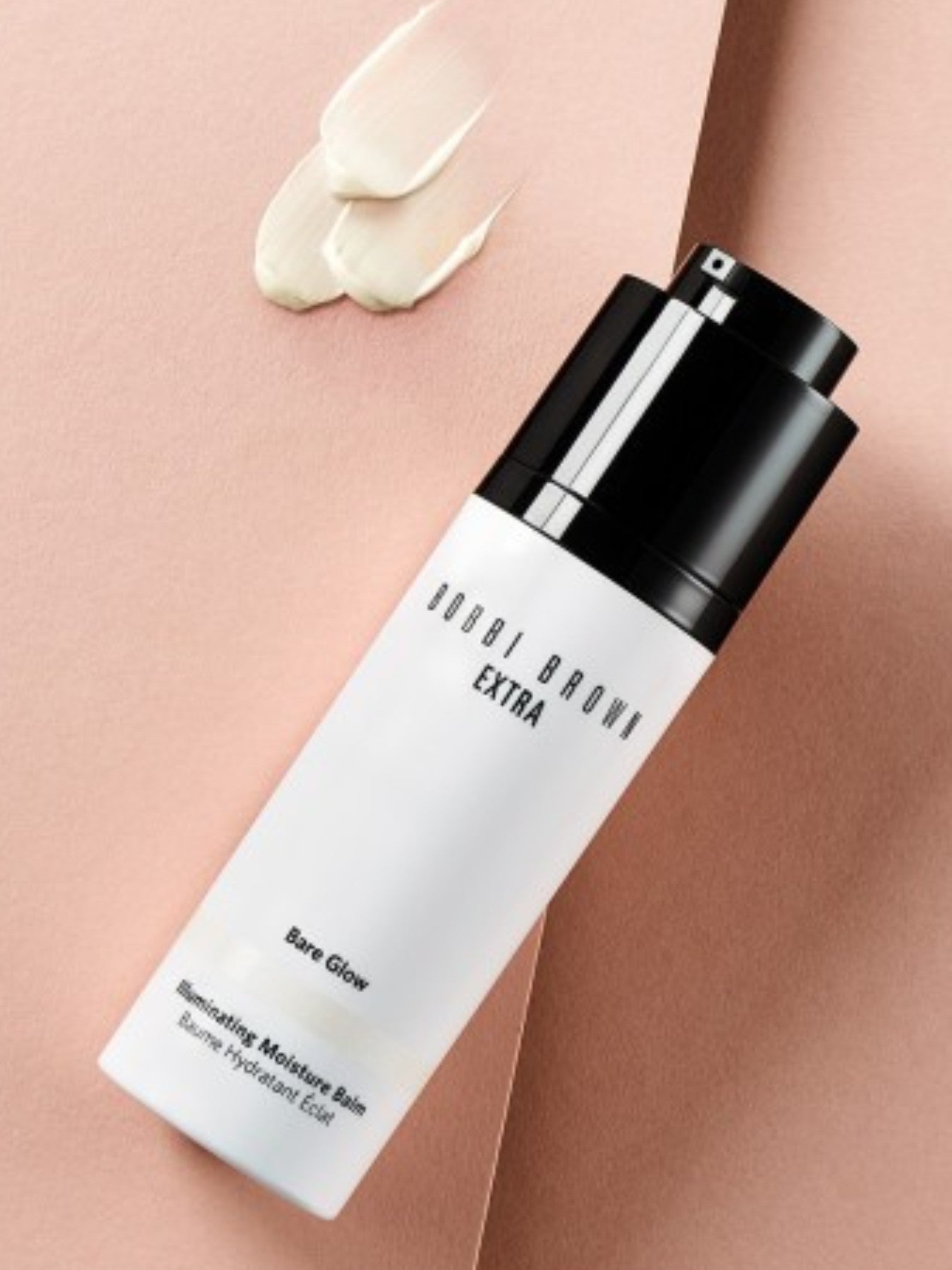 Bobbi Brown Extra Bare Glow Moisturizing Moisture Balm on a pink background. Bobbi Brown, Monza Outlet, Monza Fashion, Shein Outlet