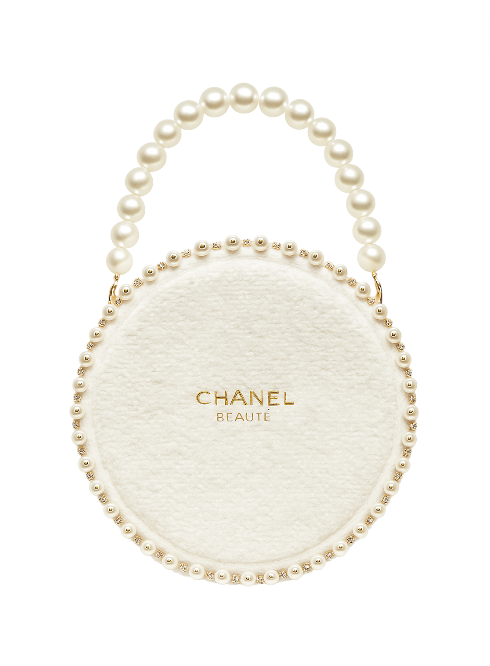 Chanel beauty product with pearl handle on a white background. Monza Outlet