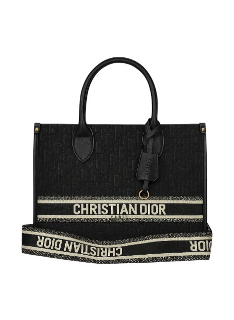 Black handbag with Christian Dior branding on a white background. Monza Outlet