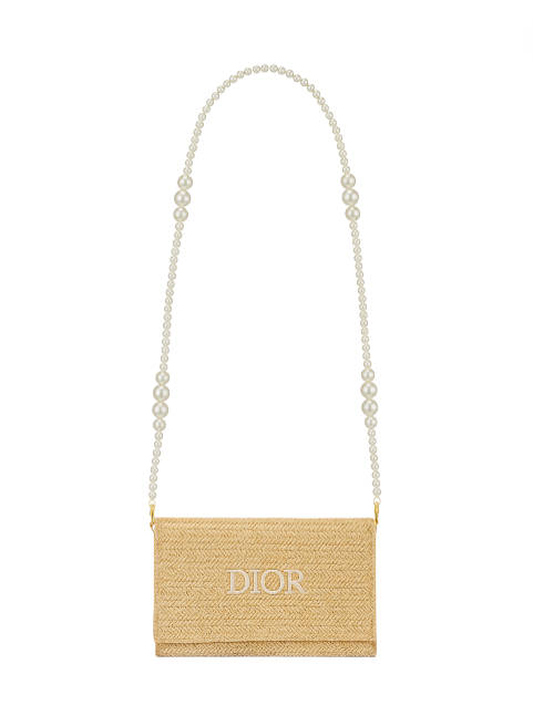 Beige handbag with pearl strap on a white background. Dior Monza Outlet
