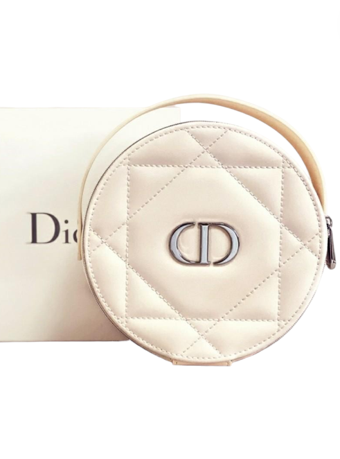 Round quilted cosmetic pouch with Dior logo on a white background. Monza Outlet