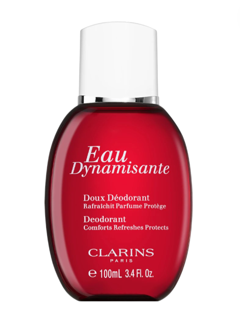 Red deodorant bottle with white cap labeled 'Eau Dynamisante' by Clarins on a white background monza outlet, Shein outlet, monza fashion