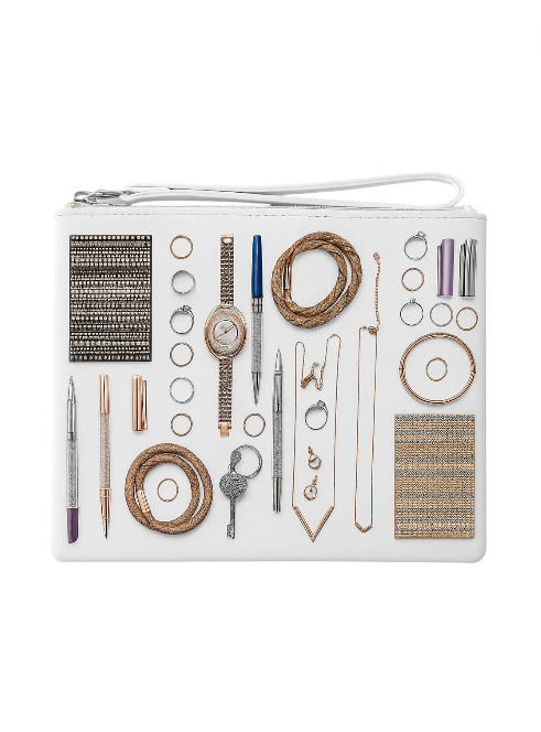 White pouch with jewelry-making tools and materials on a white background