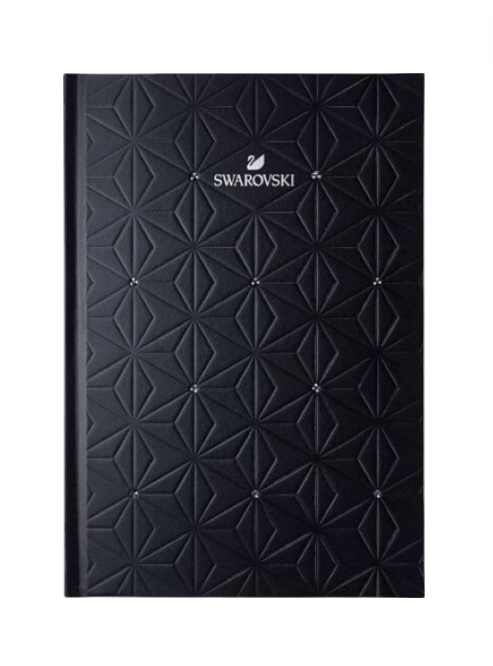 Black textured notebook with Swarovski logo on a white background. Swarovski Monza Outlet