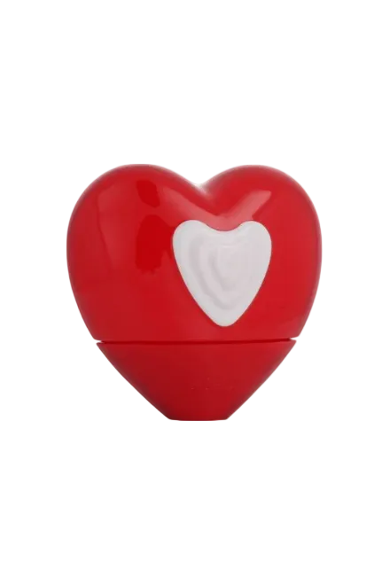 Red heart-shaped container with a white heart design on a white background