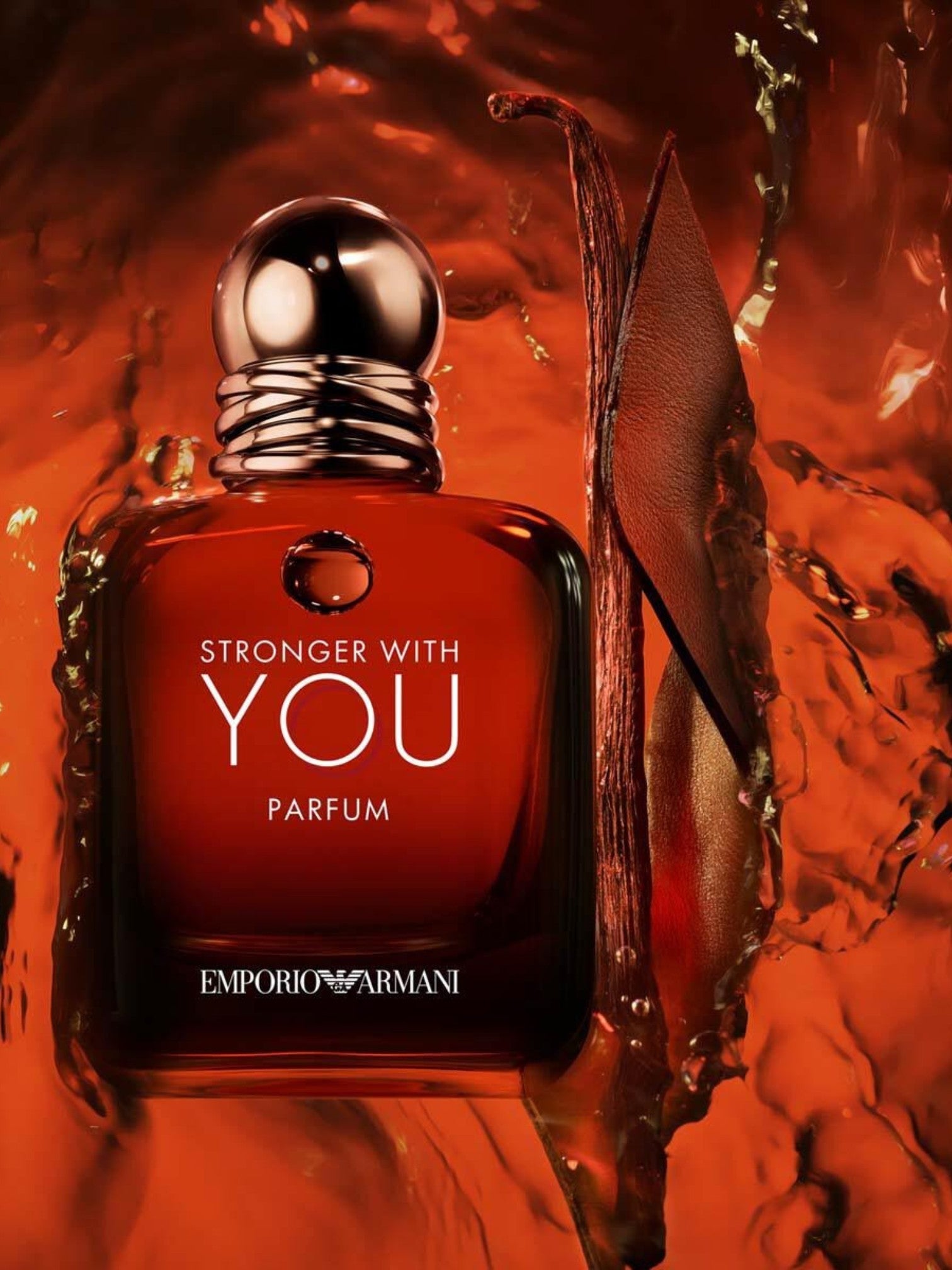Red Emporio Armani perfume bottle with Stronger with You text on an orange background. Giorgio Armani, Monza Outlet, Monza Fashion, Shein Outlet
