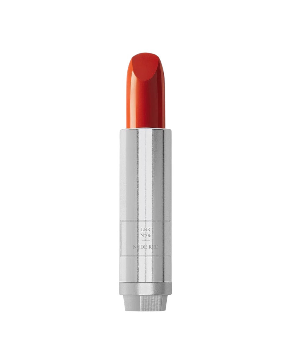 Red lipstick with silver casing on a white background
