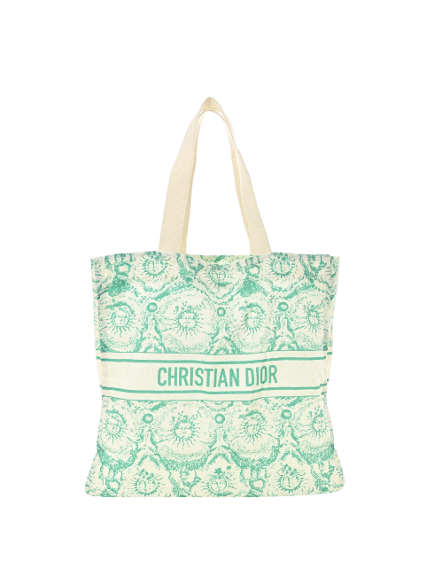 Tote bag with green pattern and Christian Dior branding on a white background. Dior Monza Outlet