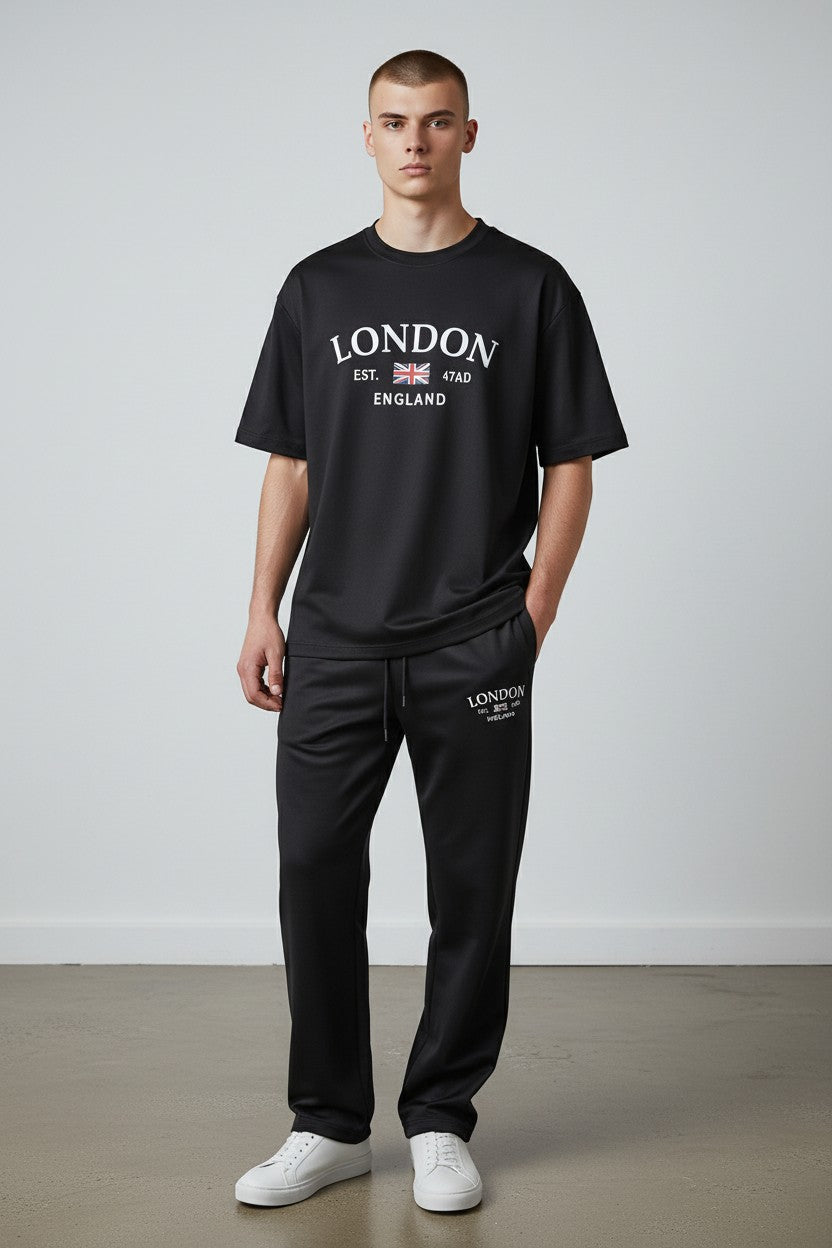 Man wearing a black London t-shirt and pants against a white background. Antler, Monza Outlet, Monza Fashion, Shein Outlet