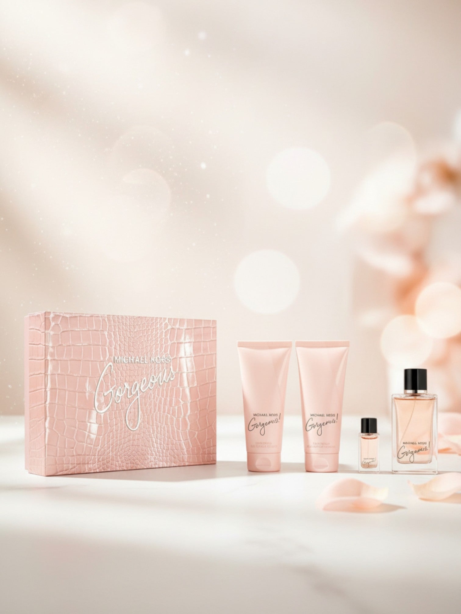 Cosmetic set with a pink box, bottles, and tubes on a light background. Michael Kors, Monza Outlet, Monza Fashion, Shein Outlet