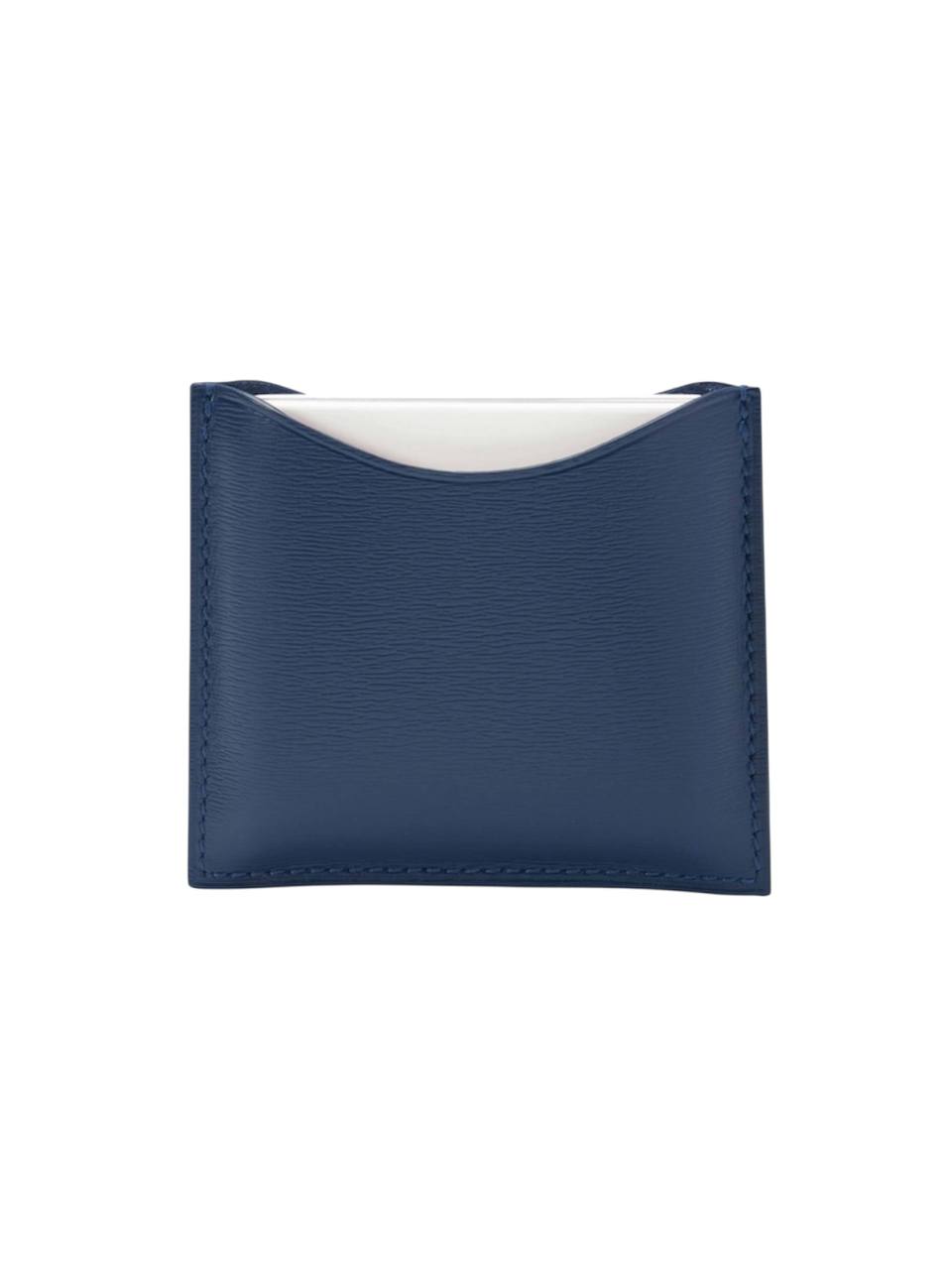 Navy blue cardholder with white interior on a white background