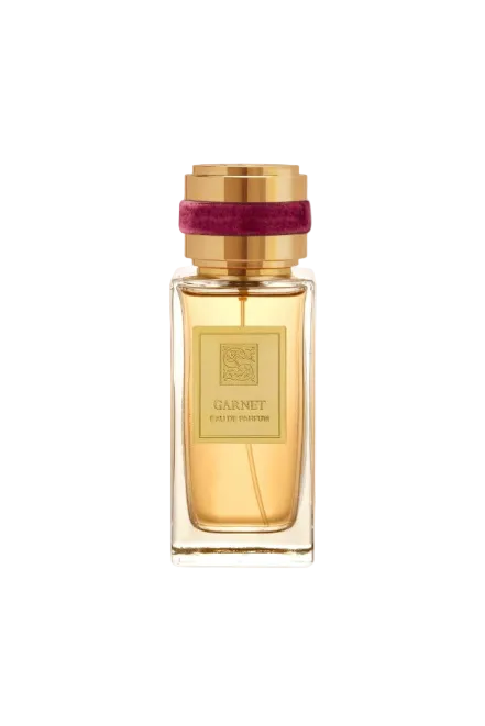 Perfume bottle with gold cap and label on a white background Signature Monza Outlet