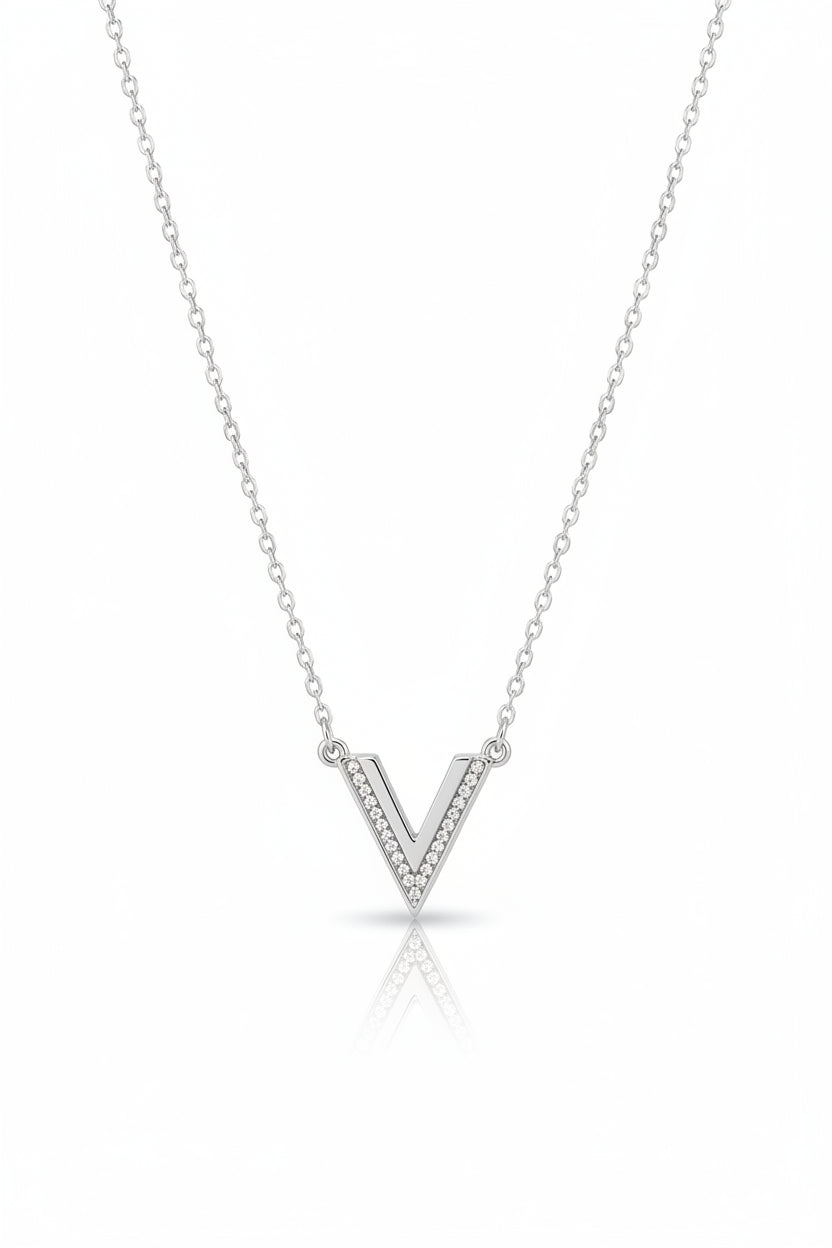 Silver necklace with a V shaped pendant on a white background. Swarovski, Monza Outlet, Monza Fashion, Shein Outlet