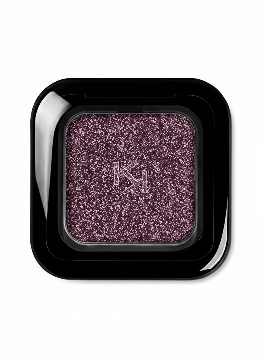 Purple glittery eyeshadow in a black compact with a brand logo on a white background. Kiko, Monza Outlet, Monza Fashion, Shein Outlet