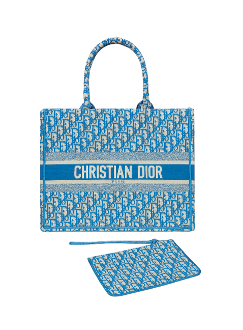 Blue Christian Dior tote bag with matching pouch on a white background Monza Outlet