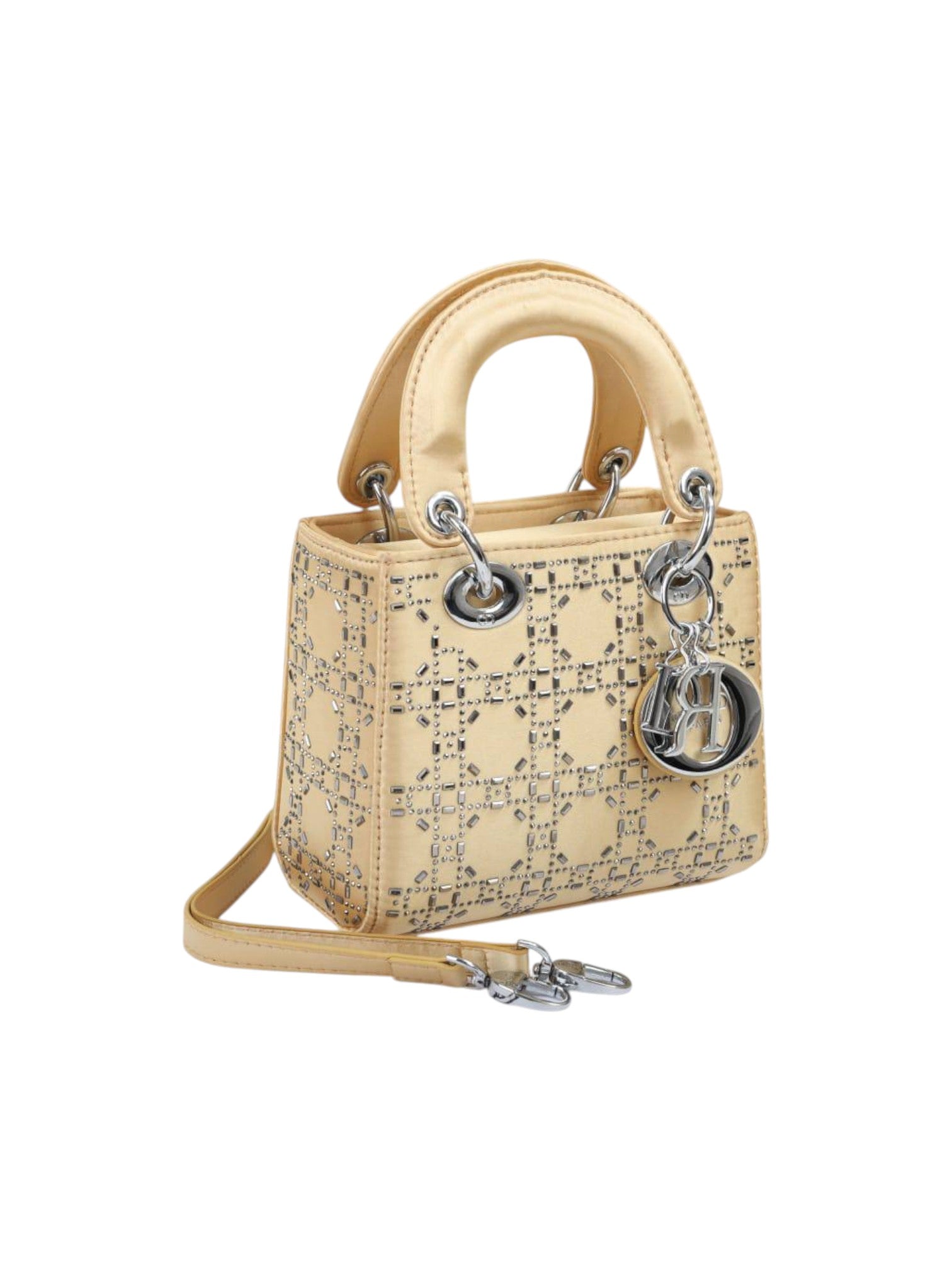 Beige handbag with Dior charm on a white background monza outlet, Shein outlet, monza fashion