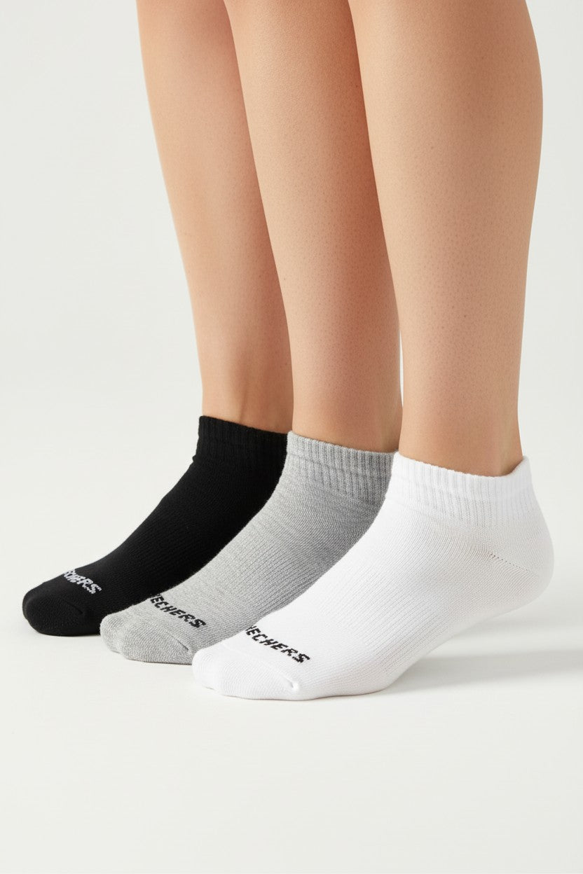 Three pairs of socks in black, gray, and white on a neutral background. Skechers, Monza Outlet, Monza Fashion, Shein Outlet