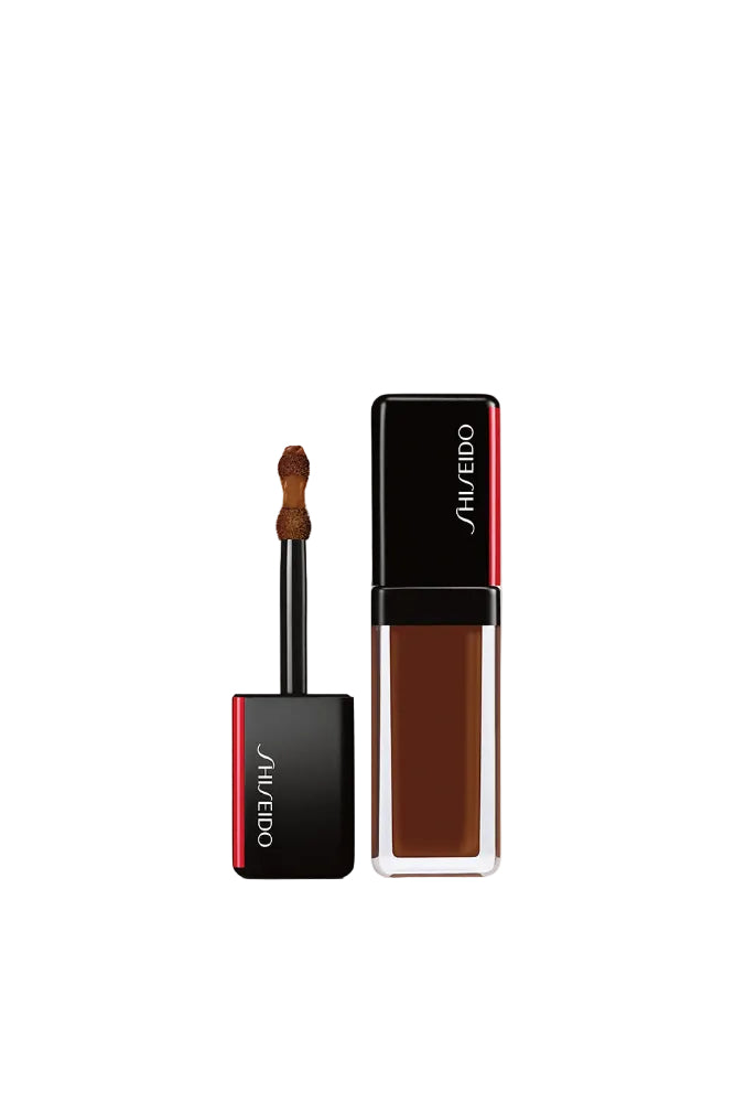 Shiseido makeup product with applicator on a white background Monza Outlet