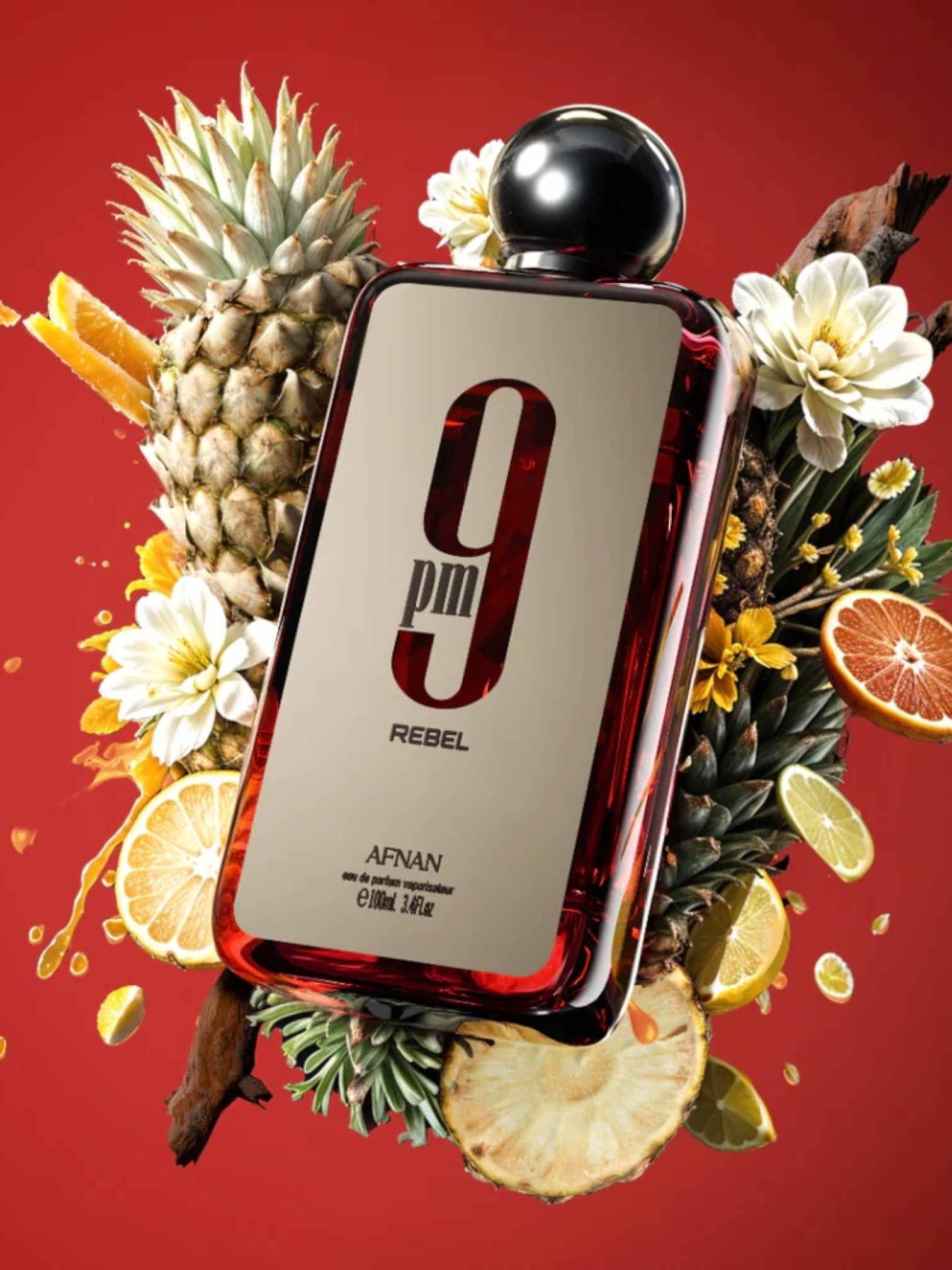 Perfume bottle labeled 9 PM Rebel by Afimun on a red background with pineapples and flowers. Afnan, Monza Outlet, Monza Fashi