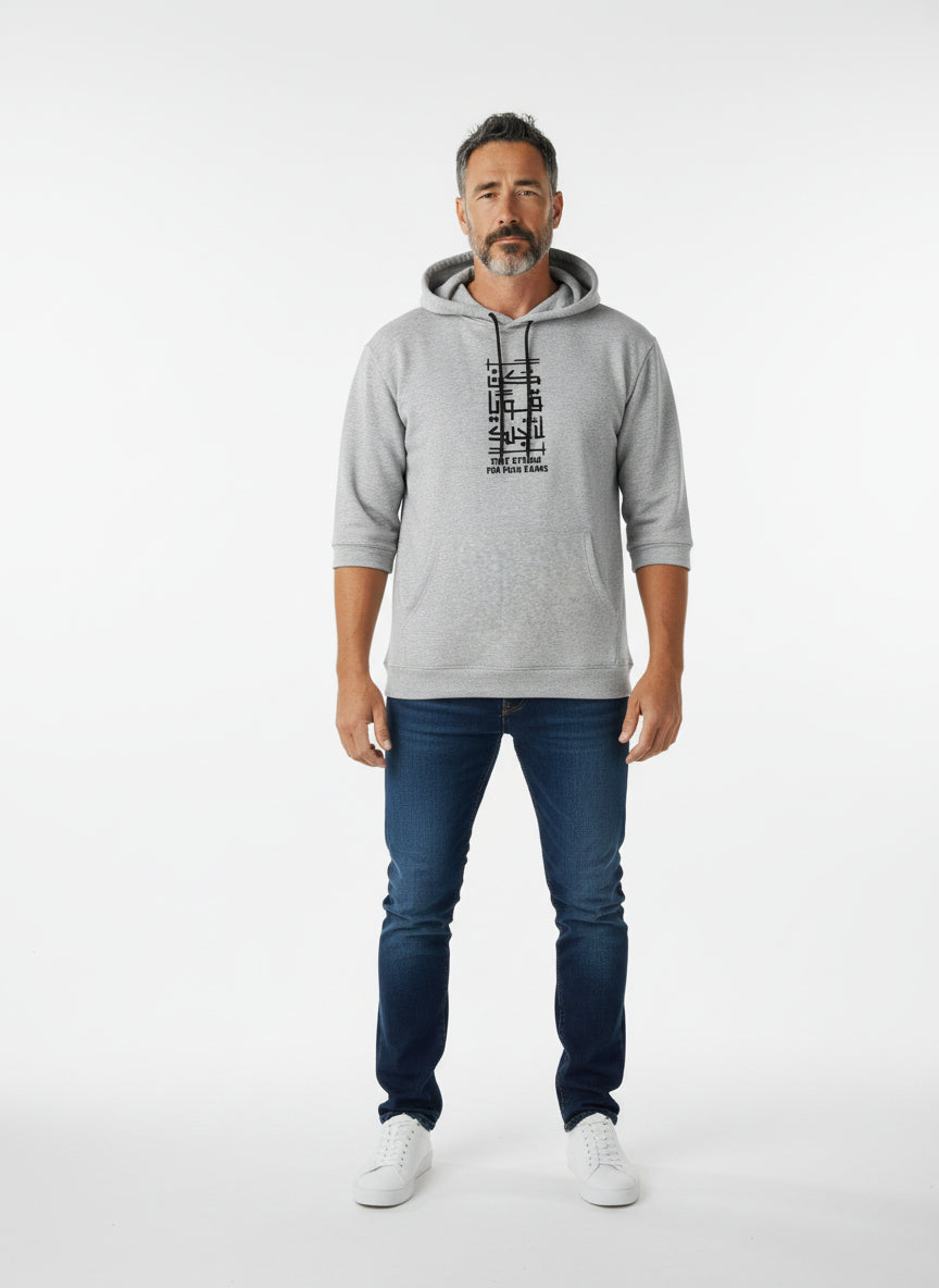 Man wearing a gray hoodie with text, blue jeans, and white sneakers on a white background. Antler, Monza Outlet, Monza Fashion, Shein Outlet