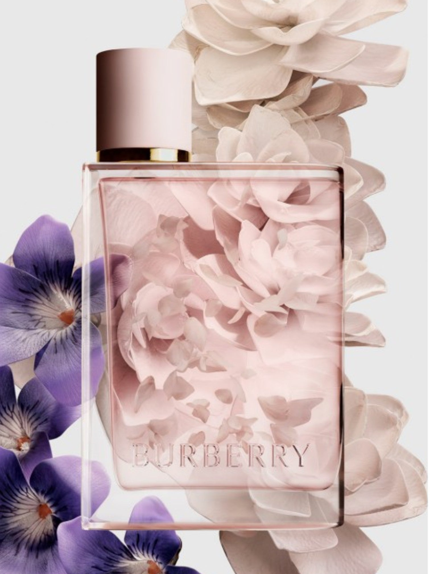 Burberry perfume bottle with floral design and flowers around it. Burberry, Monza Outlet, Monza Fashion, Shein Outlet