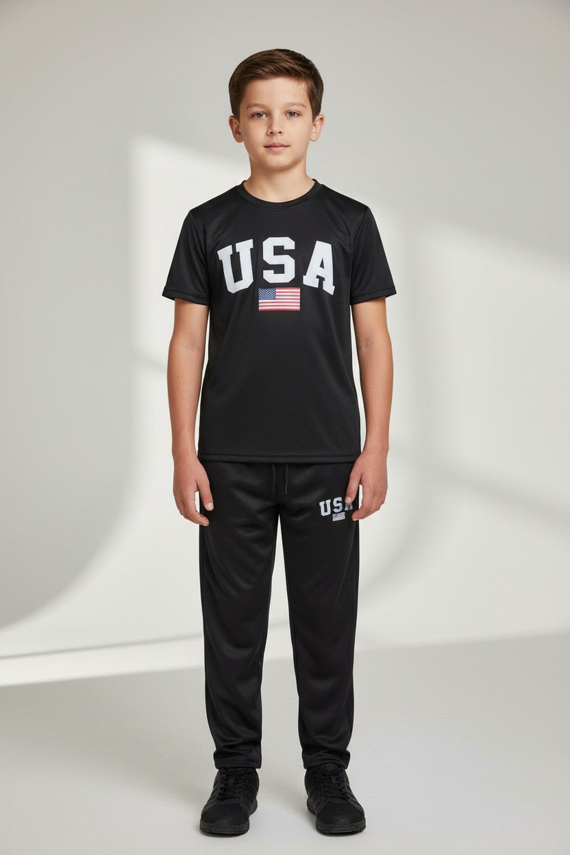 Child wearing a black USA t-shirt and pants with an American flag on a white background. Antler, Monza Outlet, Monza Fashion, Shein Outlet