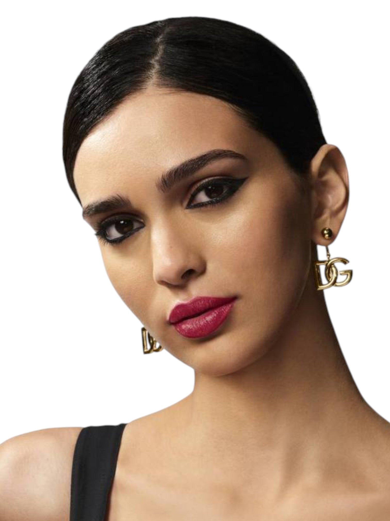 Woman wearing gold earrings with a plain background Dolce Gabbana Monza Outlet