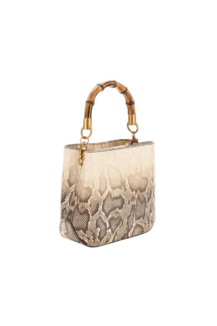 Designer handbag with snake skin pattern and gold accents on a white background. Guess, Monza Outlet, Monza Fashion, Shein Outlet