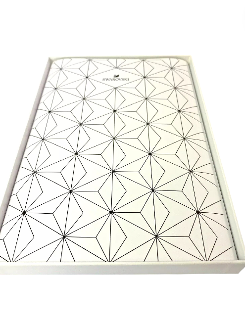 White box with black geometric pattern on a white background, Swarovski, Monza Outlet, Monza Fashion, Shein Outlet