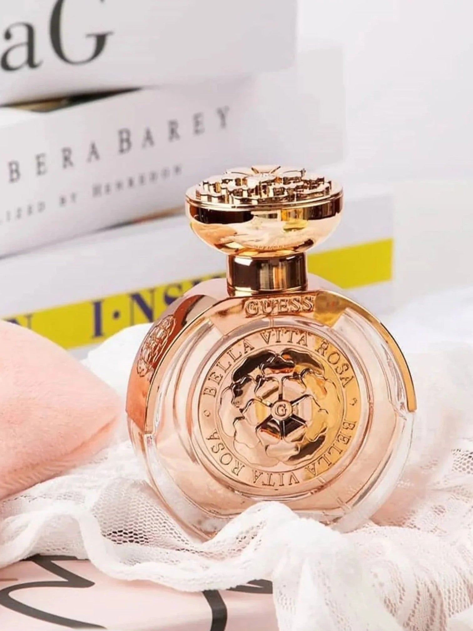 Perfume bottle with gold cap and label on a white surface monza outlet, Shein outlet, monza fashion