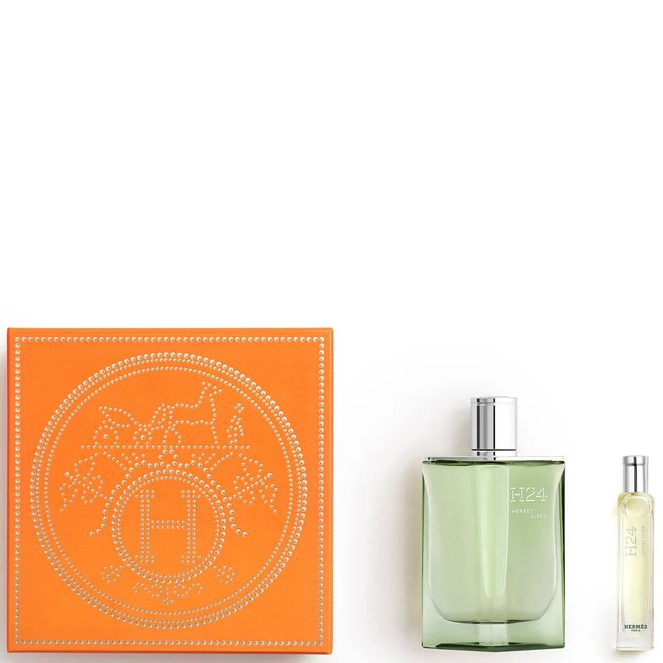Perfume bottle and packaging with H logo on a white background Monza Outlet