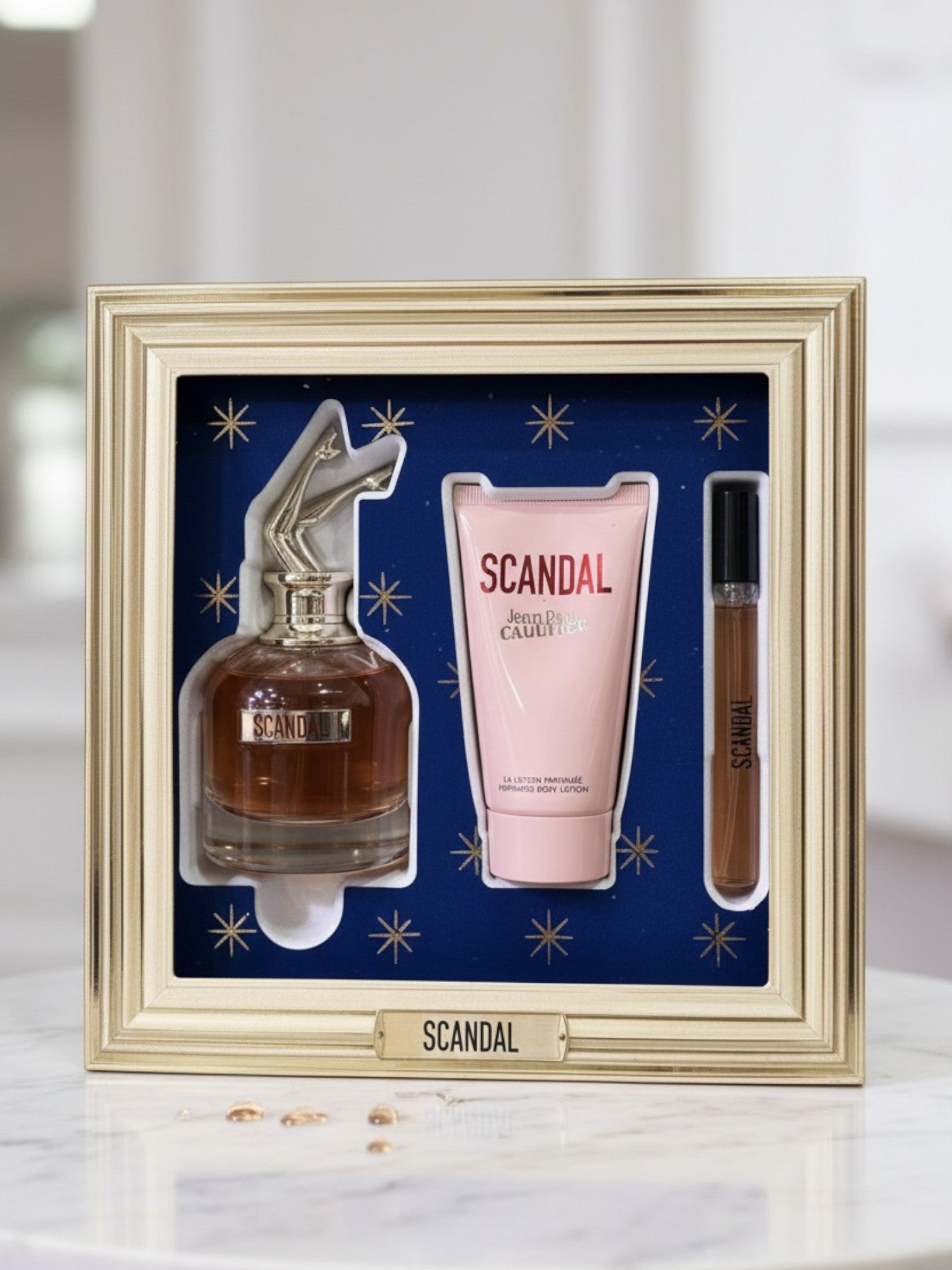 Perfume set with SCANDAL branding in a decorative frame. Jean Paul Gaultier, Monza Outlet, Monza Fashion, Shein Outlet