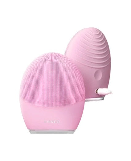 Pink silicone facial cleansing brush with FOREO branding on a white background Monza Outlet