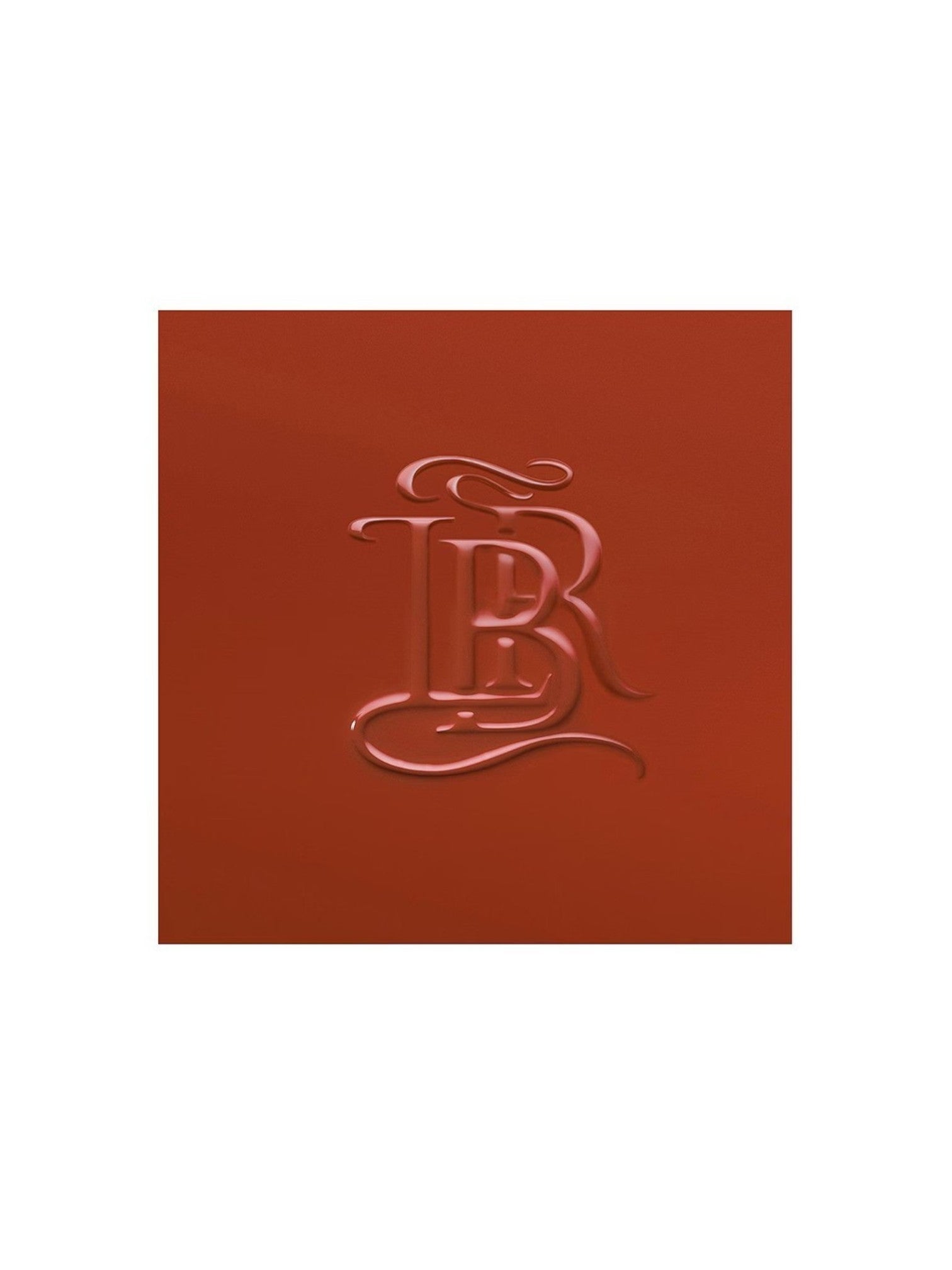Red leather-bound book with an embossed letter 'B' on a white background