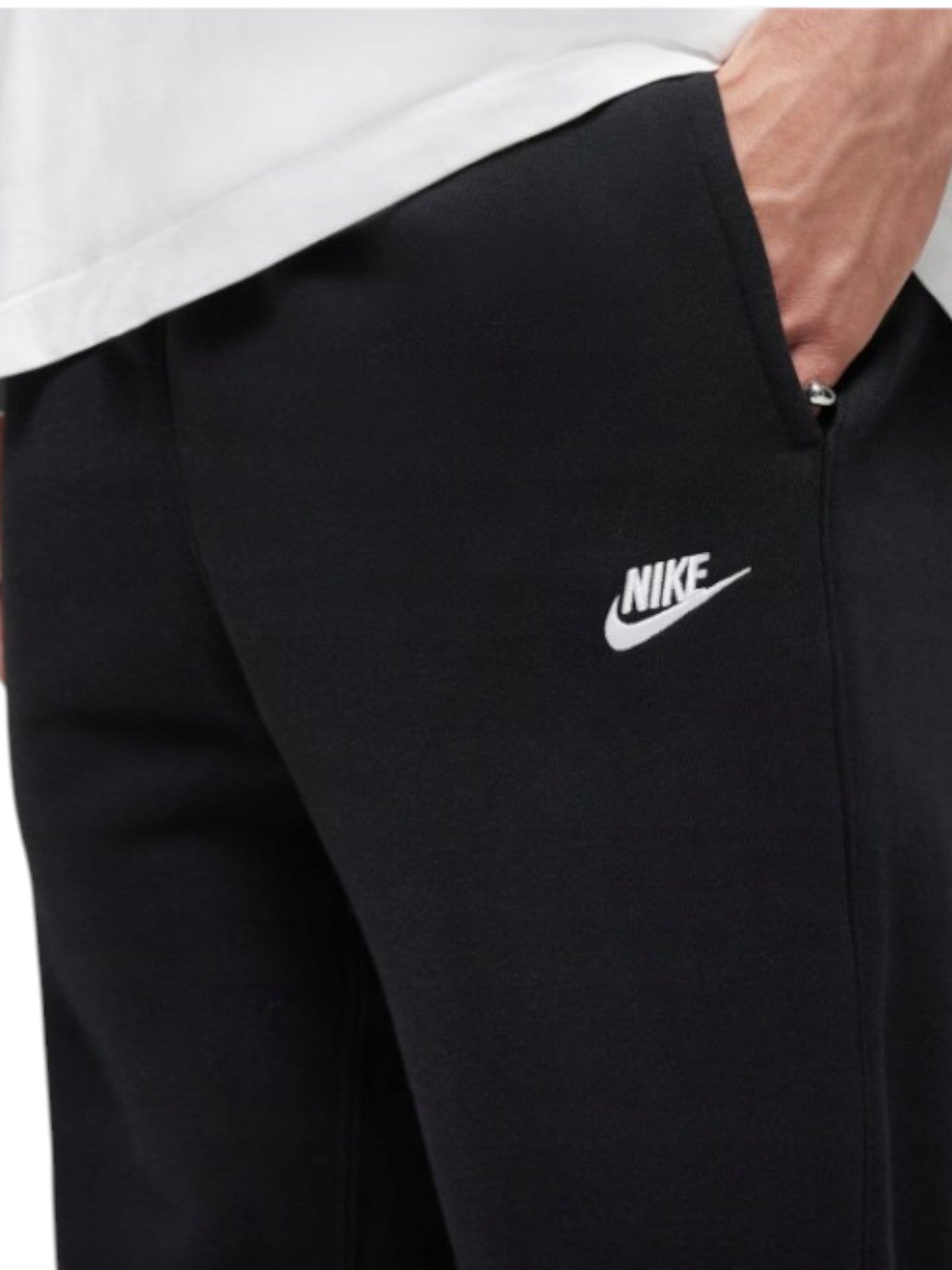 Black Nike pants with a white logo on a white background. Nike, Monza Outlet, Monza Fashion, Shein Outlet