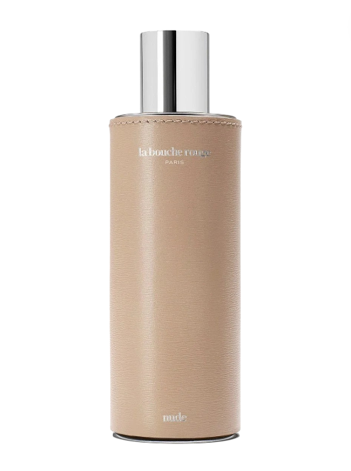 Beige bottle with silver cap on a white background