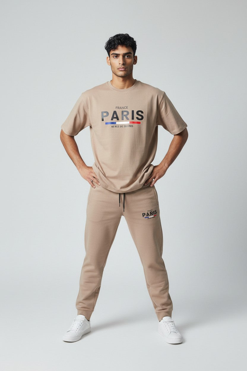 Man wearing a beige Paris t-shirt and pants on a white background. Antler, Monza Outlet, Monza Fashion, Shein Outlet