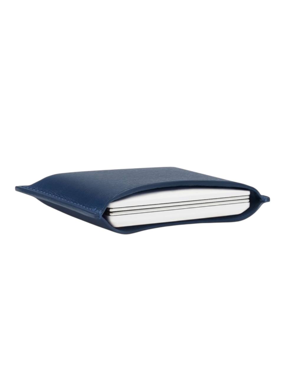 Blue leather-bound notebook on a white background
