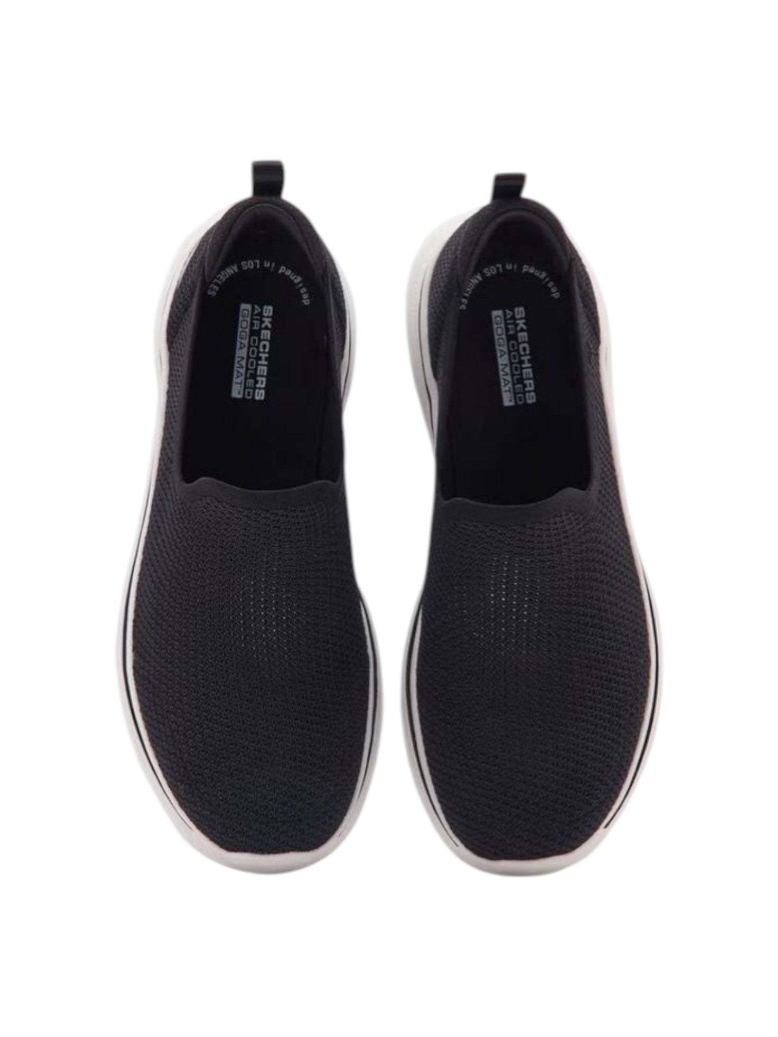 Black slip-on shoes with white soles on a white background. Skechers, Monza Outlet, Monza Fashion, Shein Outlet