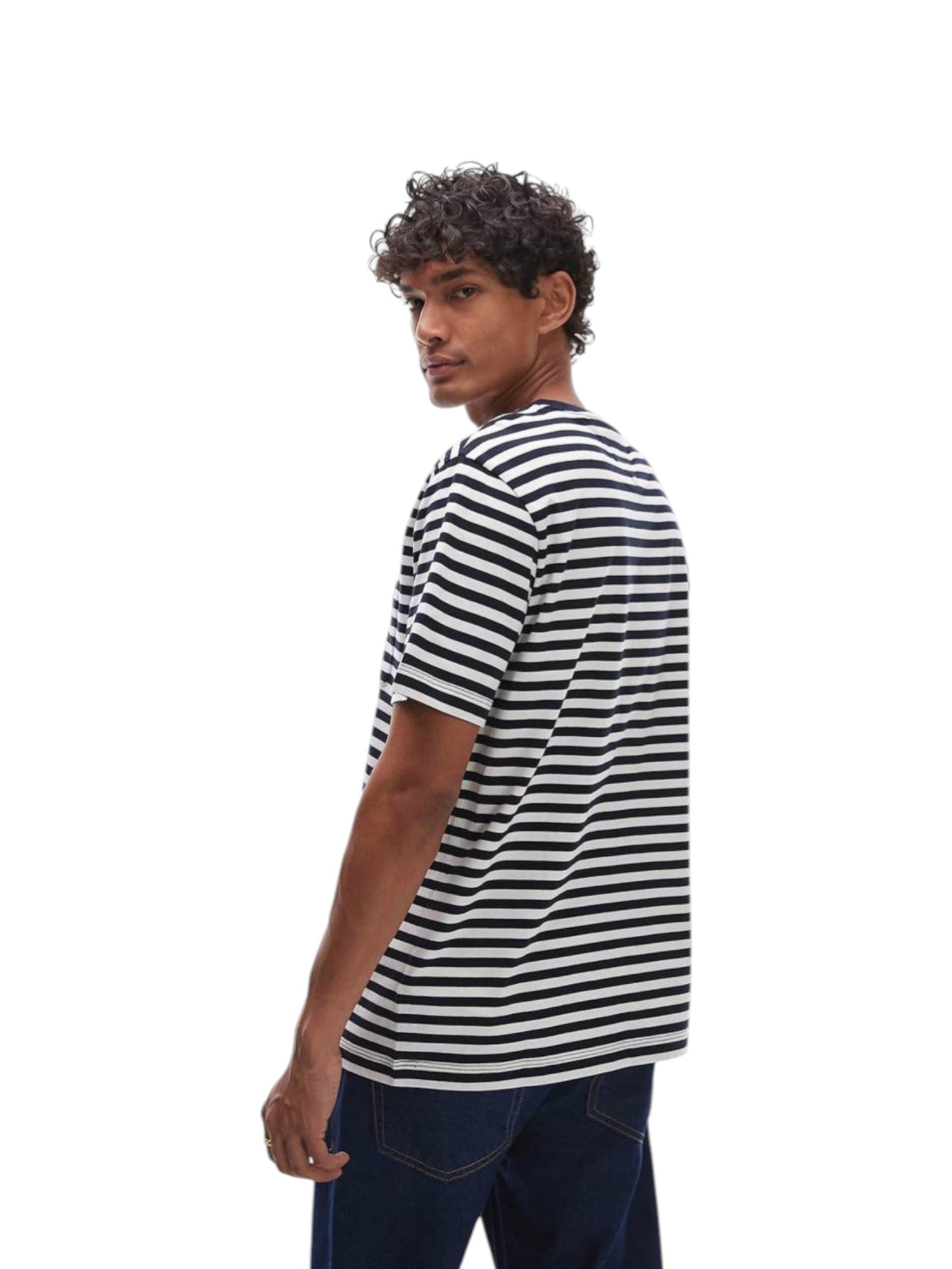 Man wearing a black and white striped t-shirt on a white background. Tommy, Monza Outlet, Monza Fashion, Shein Outlet