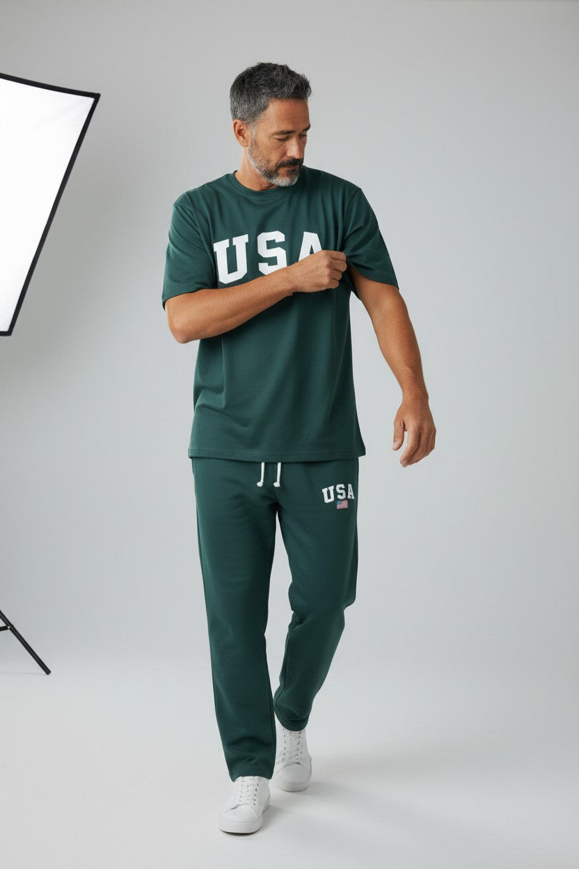 Man wearing a green USA t-shirt and pants on a white background. Antler, Monza Outlet, Monza Fashion, Shein Outlet