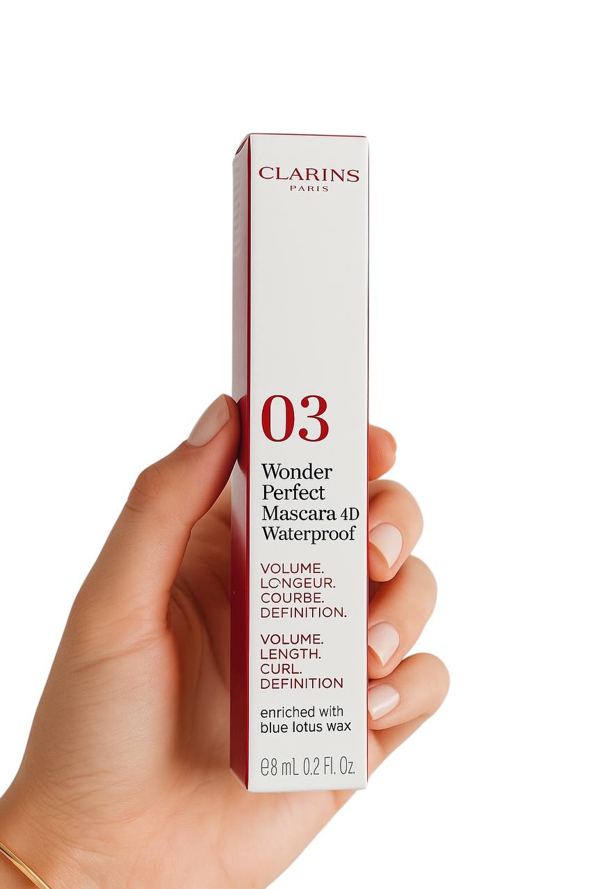 Hand holding a Clarins Wonder Perfect Mascara 4D Waterproof tube on a white background monza outlet, Shein outlet, monza fashion