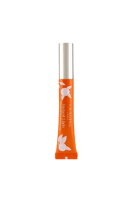 Orange lip balm tube with silver cap on a white background Clarins Monza Outlet, Monza Fashion, Shein Outlet