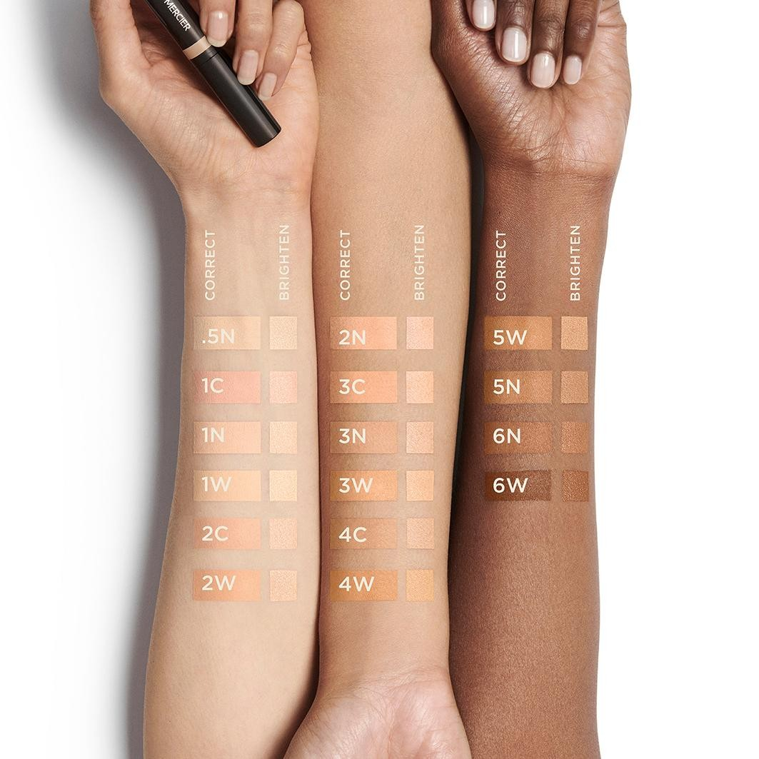 Three arms with different skin tones displaying makeup swatches on a white background. Monza fashion outlet, monza outlet, shein outlet, shien outlet cosmetics, makeup, perfume