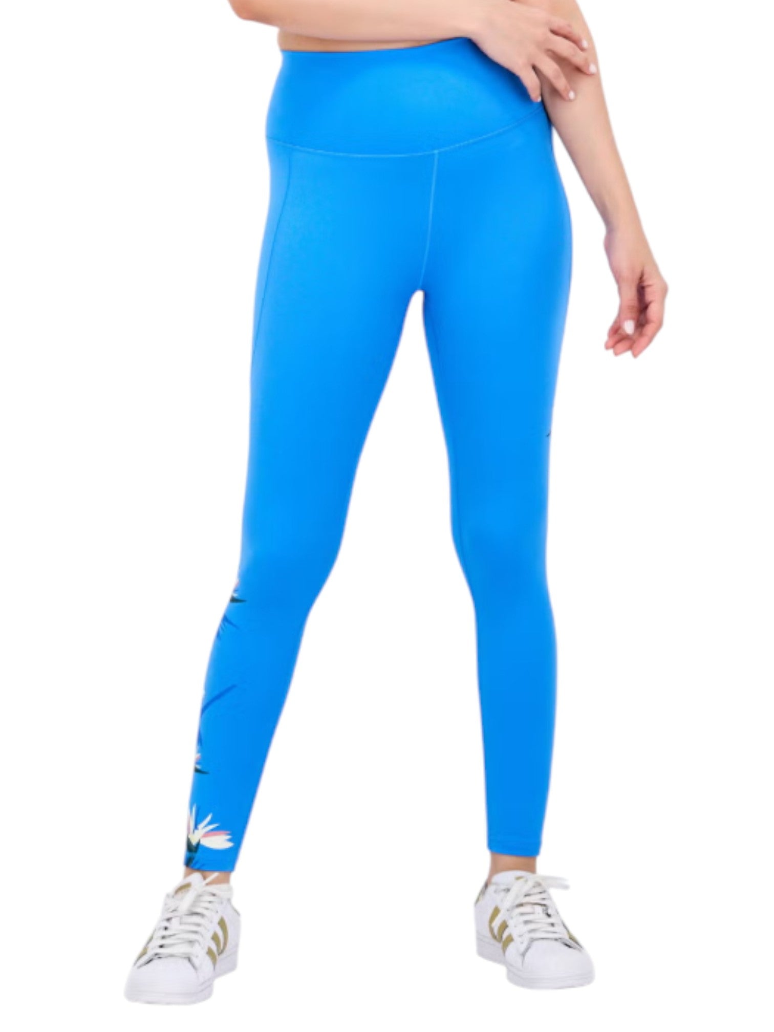 Blue leggings worn by a person on a white background. Adidas, Monza Outlet, Monza Fashion, Shein Outlet